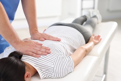 Photo of Physiotherapist working with patient in rehabilitation center, closeup