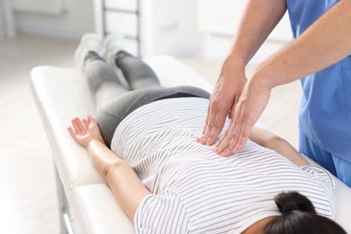 Physiotherapist working with patient in rehabilitation center, closeup