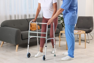 Photo of Rehabilitation. Physiotherapist working with senior patient indoors, closeup