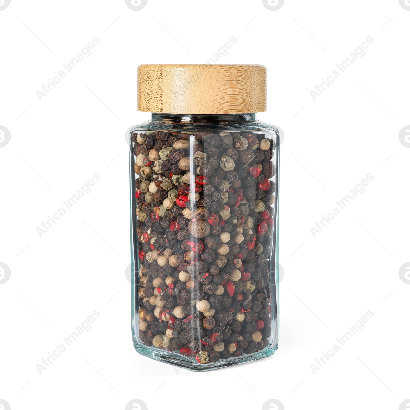 Photo of Peppercorns in glass jar isolated on white