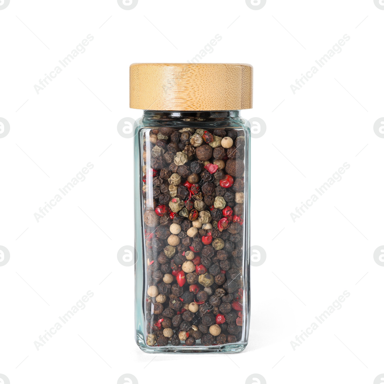 Photo of Peppercorns in glass jar isolated on white