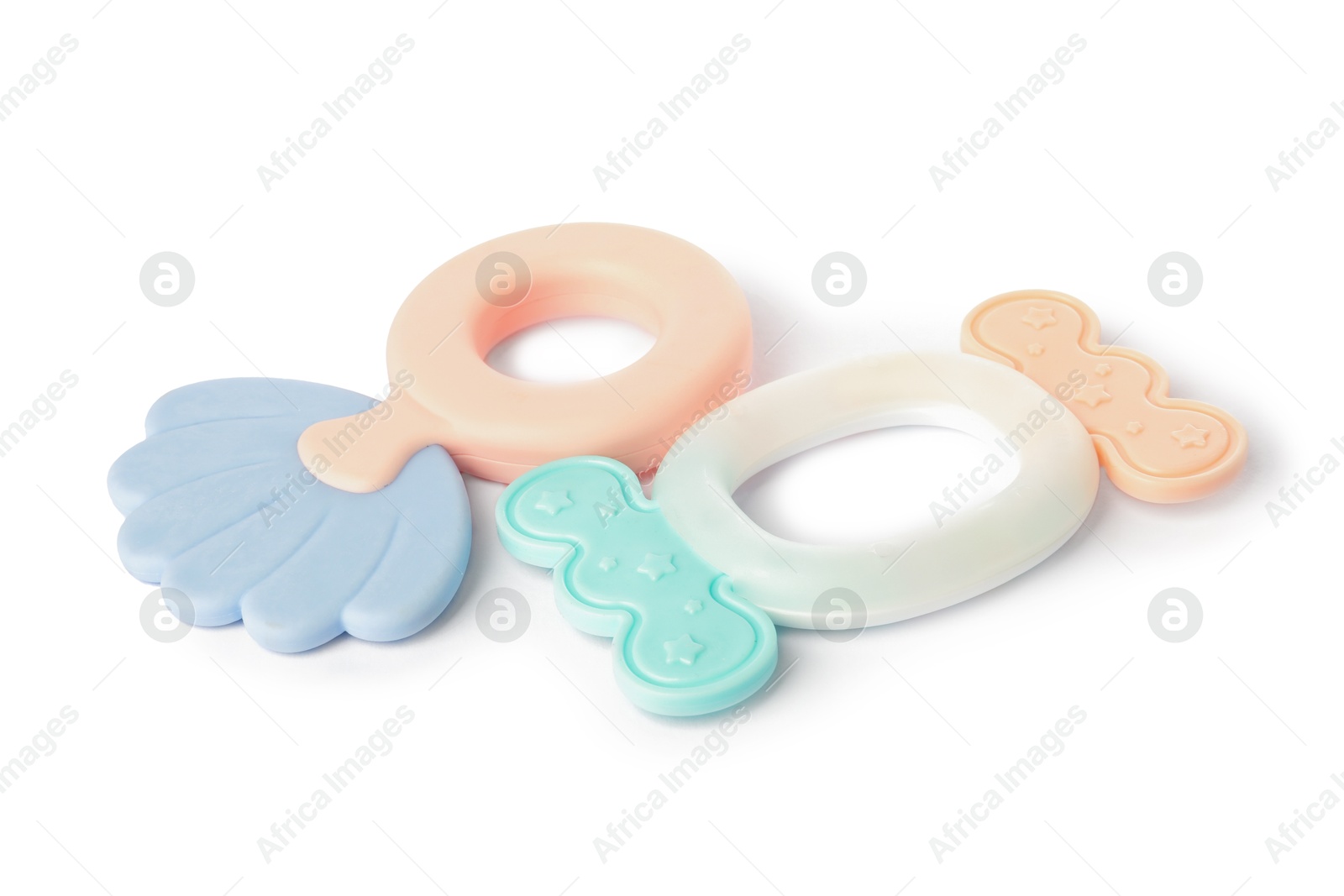 Photo of Colorful rattles isolated on white. Baby accessories