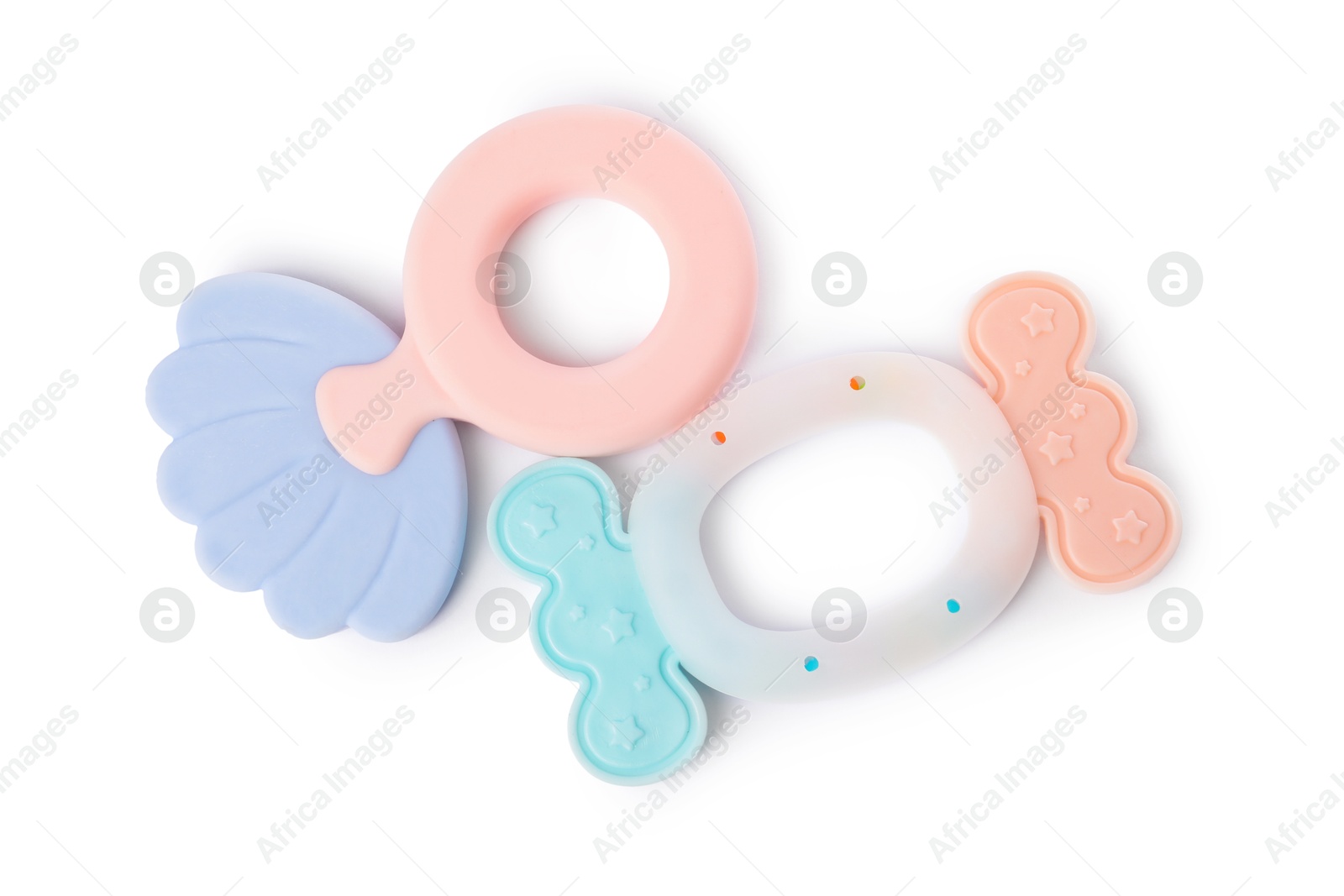 Photo of Colorful rattles isolated on white, top view. Baby accessories