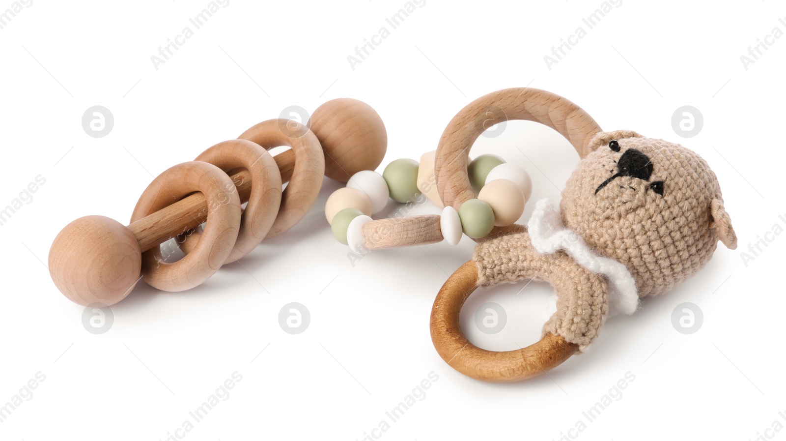 Photo of Wooden rattles isolated on white. Baby accessories