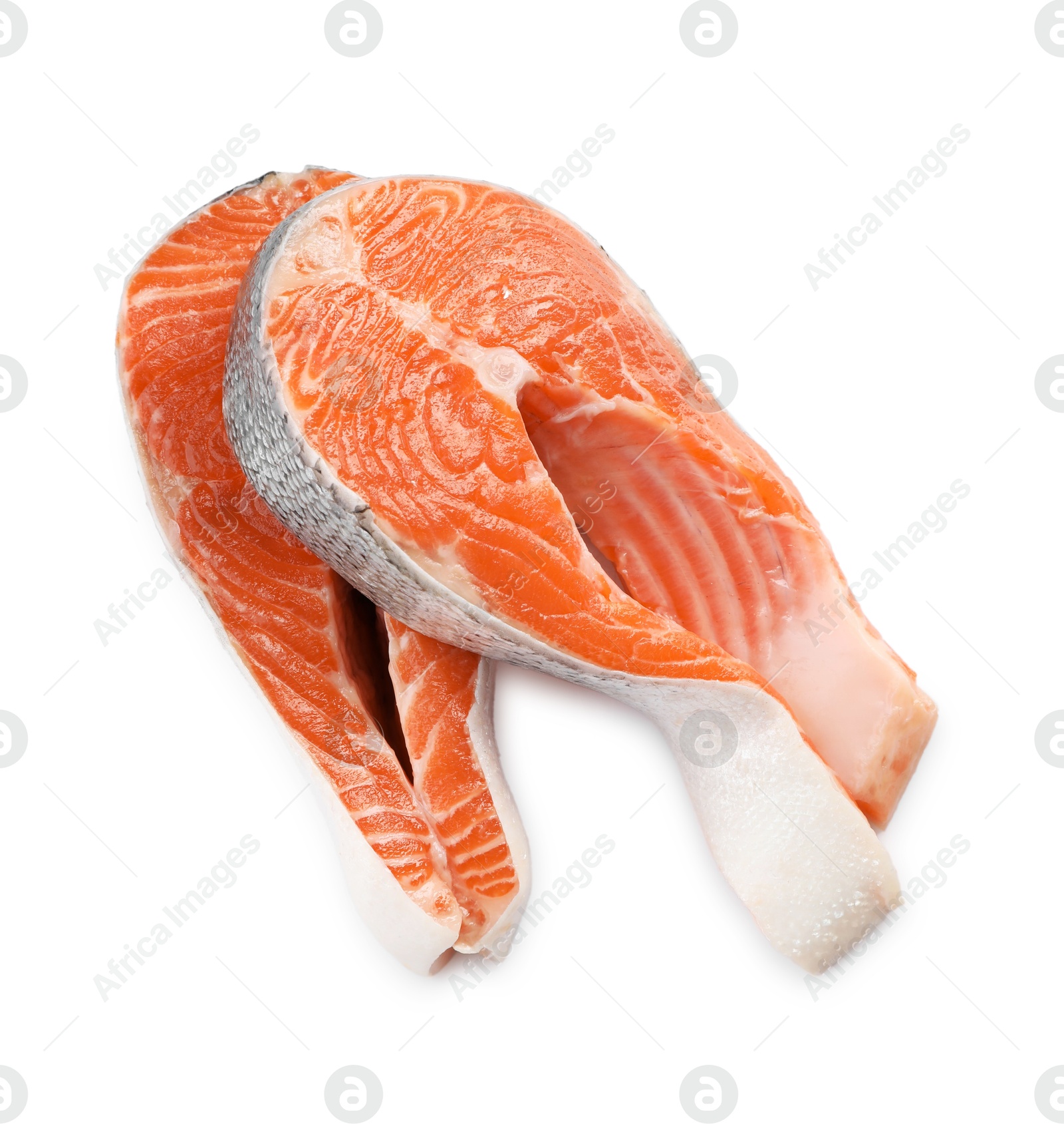 Photo of Two fresh salmon steaks isolated on white, above view