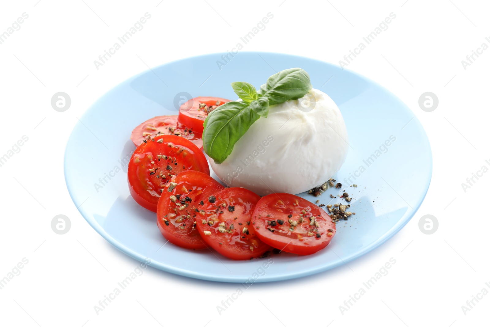 Photo of Delicious burrata cheese, tomatoes, basil and spices isolated on white