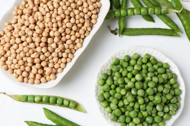 Photo of Dried, fresh peas and pods on white table, flat lay