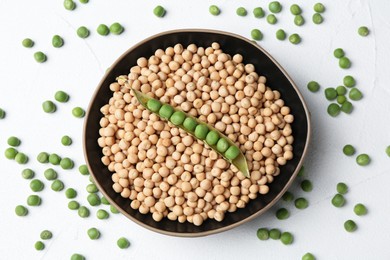 Dried peas and pod with fresh ones on white textured table, flat lay