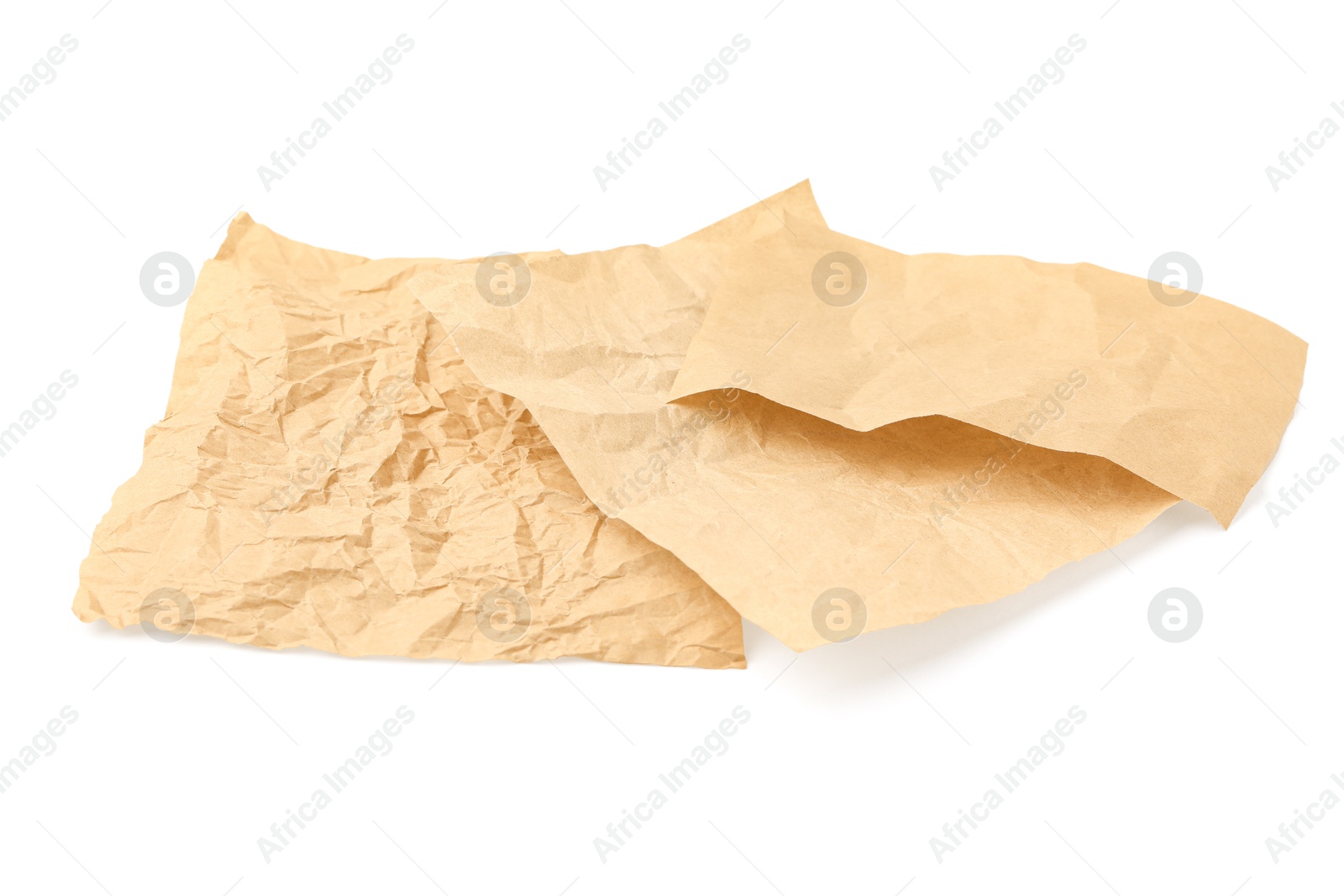 Photo of Crumpled kraft paper sheets isolated on white