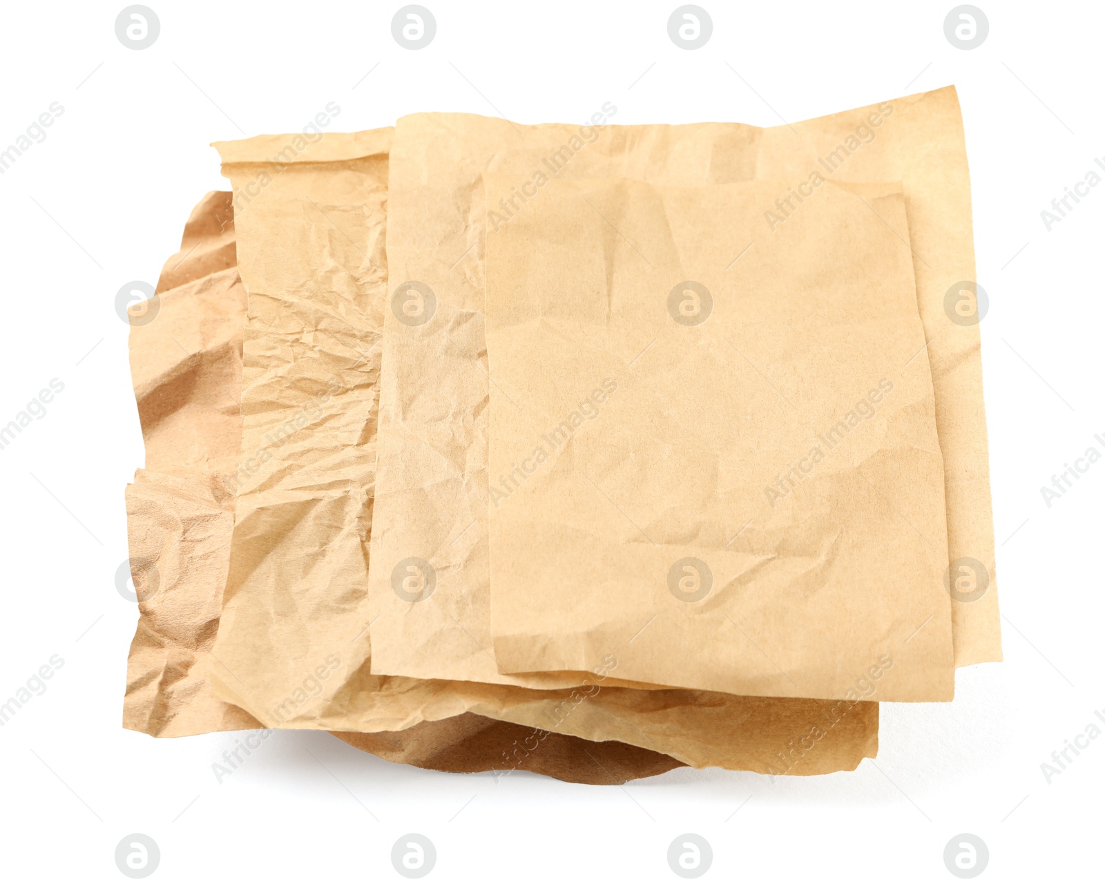 Photo of Crumpled kraft paper sheets isolated on white