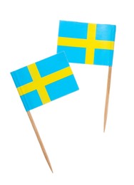 Small paper flags of Sweden isolated on white