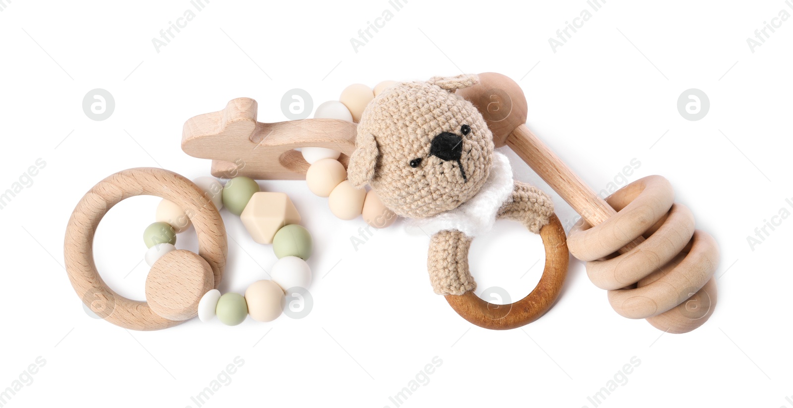 Photo of Wooden rattles isolated on white, top view. Baby accessories