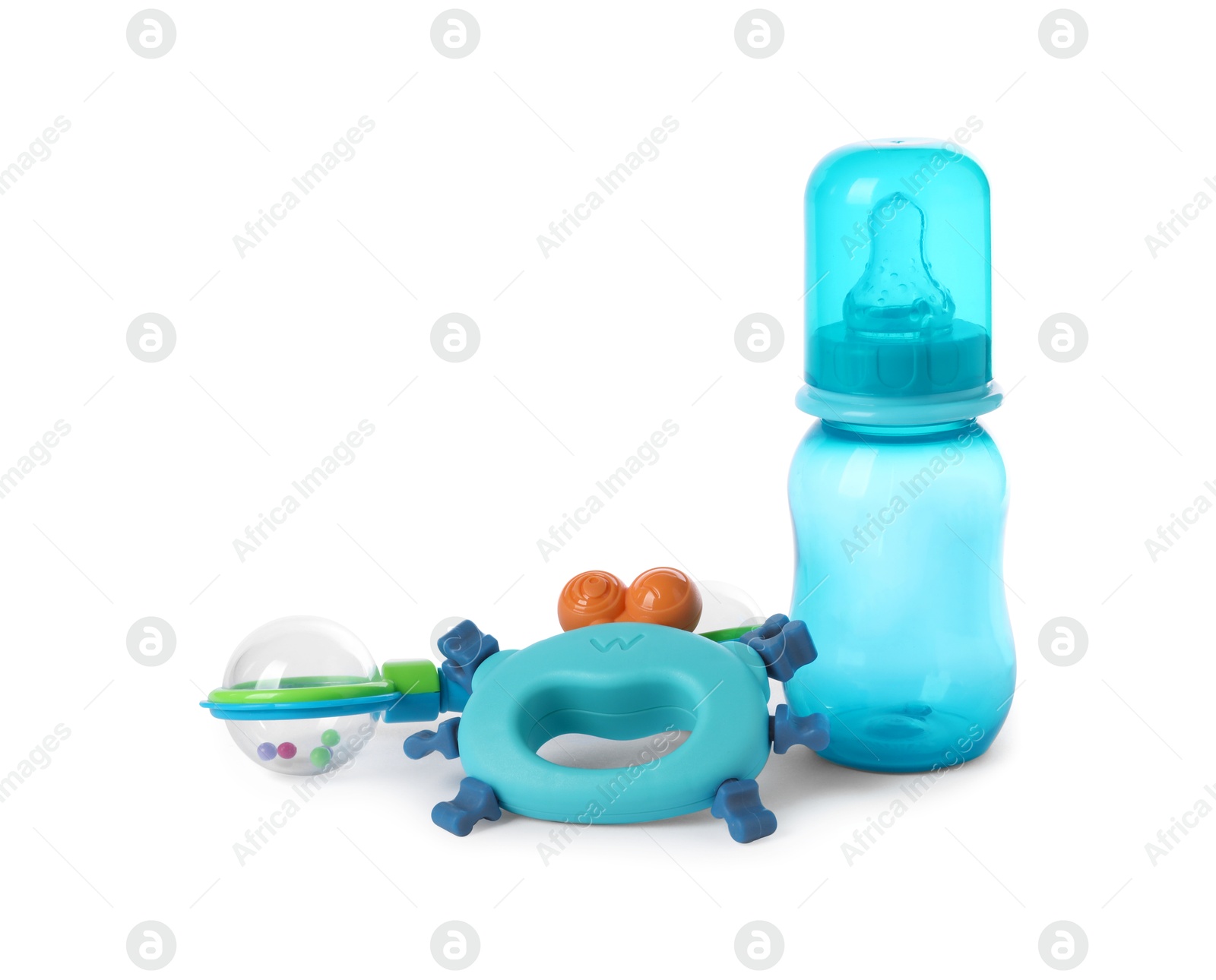 Photo of Baby rattles and bottle isolated on white