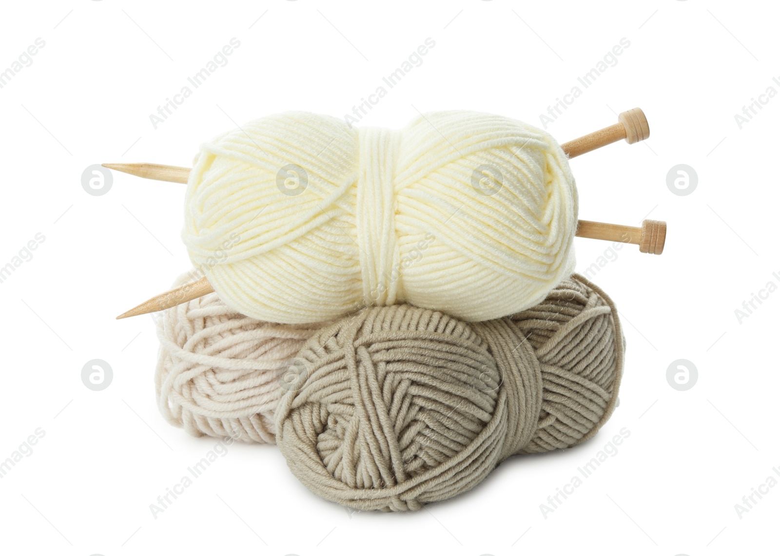 Photo of Skeins of soft yarn and knitting needles isolated on white