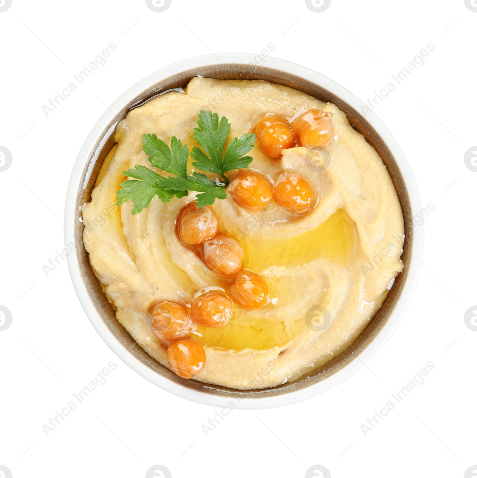 Photo of Delicious hummus with olive oil, chickpeas and parsley isolated on white, top view