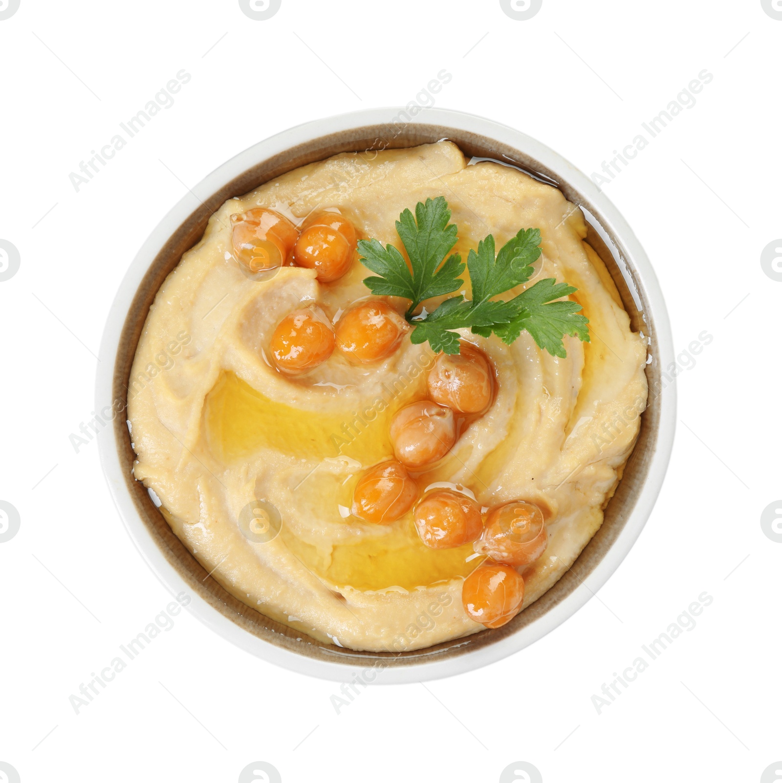 Photo of Delicious hummus with olive oil, chickpeas and parsley isolated on white, top view