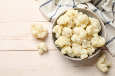 Photo of Tasty cooked cauliflower on white wooden table, top view. Space for text