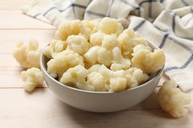 Photo of Tasty cooked cauliflower on white wooden table, closeup