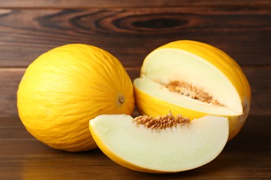 Fresh ripe melons on wooden table. Summer fruit