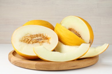 Fresh ripe melons on white table. Summer fruit