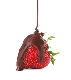 Photo of Pouring melted chocolate onto fresh strawberry isolated on white