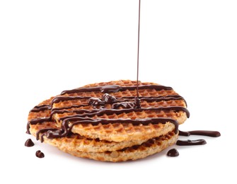 Photo of Pouring melted chocolate onto waffles isolated on white