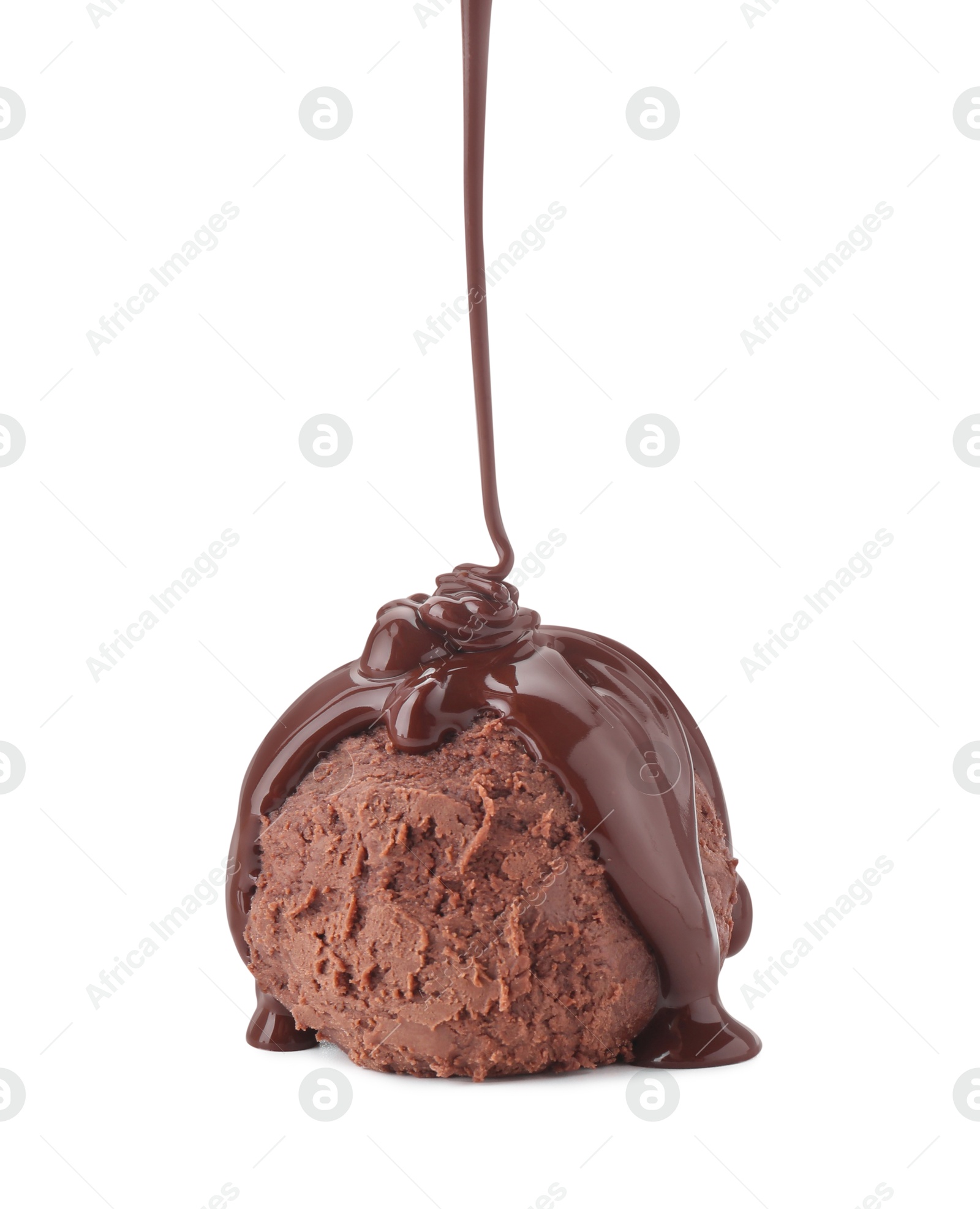 Photo of Pouring melted chocolate onto ice cream isolated on white