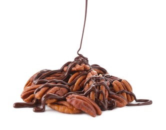 Photo of Pouring melted chocolate onto pecan nuts isolated on white