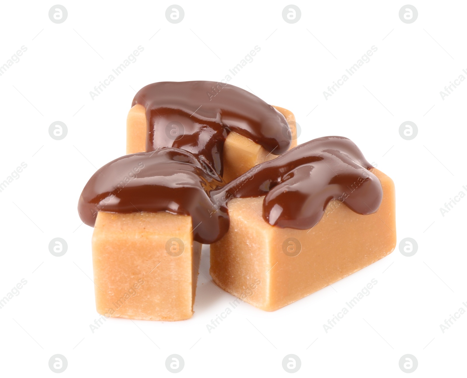 Photo of Tasty caramel candies with melted chocolate isolated on white