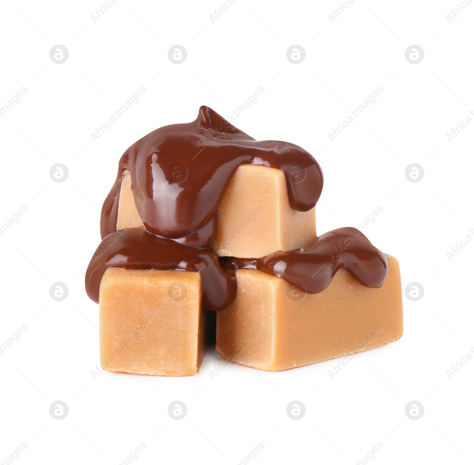 Photo of Tasty caramel candies with melted chocolate isolated on white