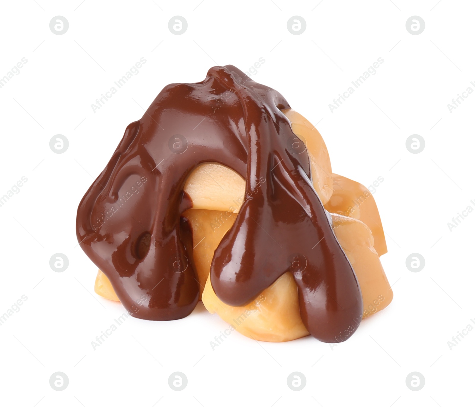 Photo of Tasty caramel candies with melted chocolate isolated on white