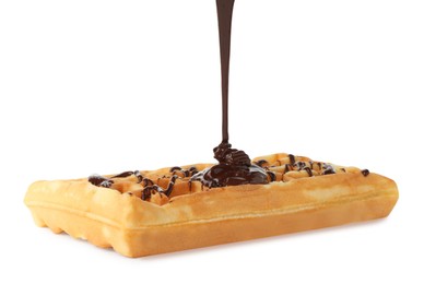 Photo of Pouring delicious melted chocolate onto waffle isolated on white