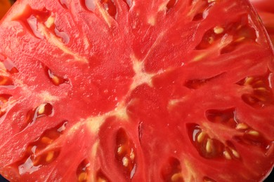 Photo of Cut ripe red tomato as background, top view