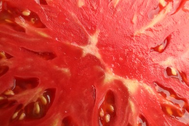 Cut ripe red tomato as background, top view