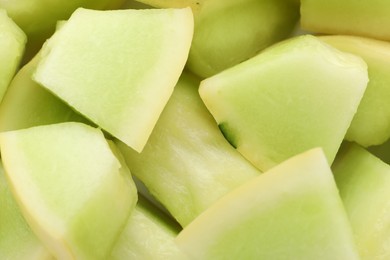 Photo of Many pieces of sweet honeydew melon, closeup