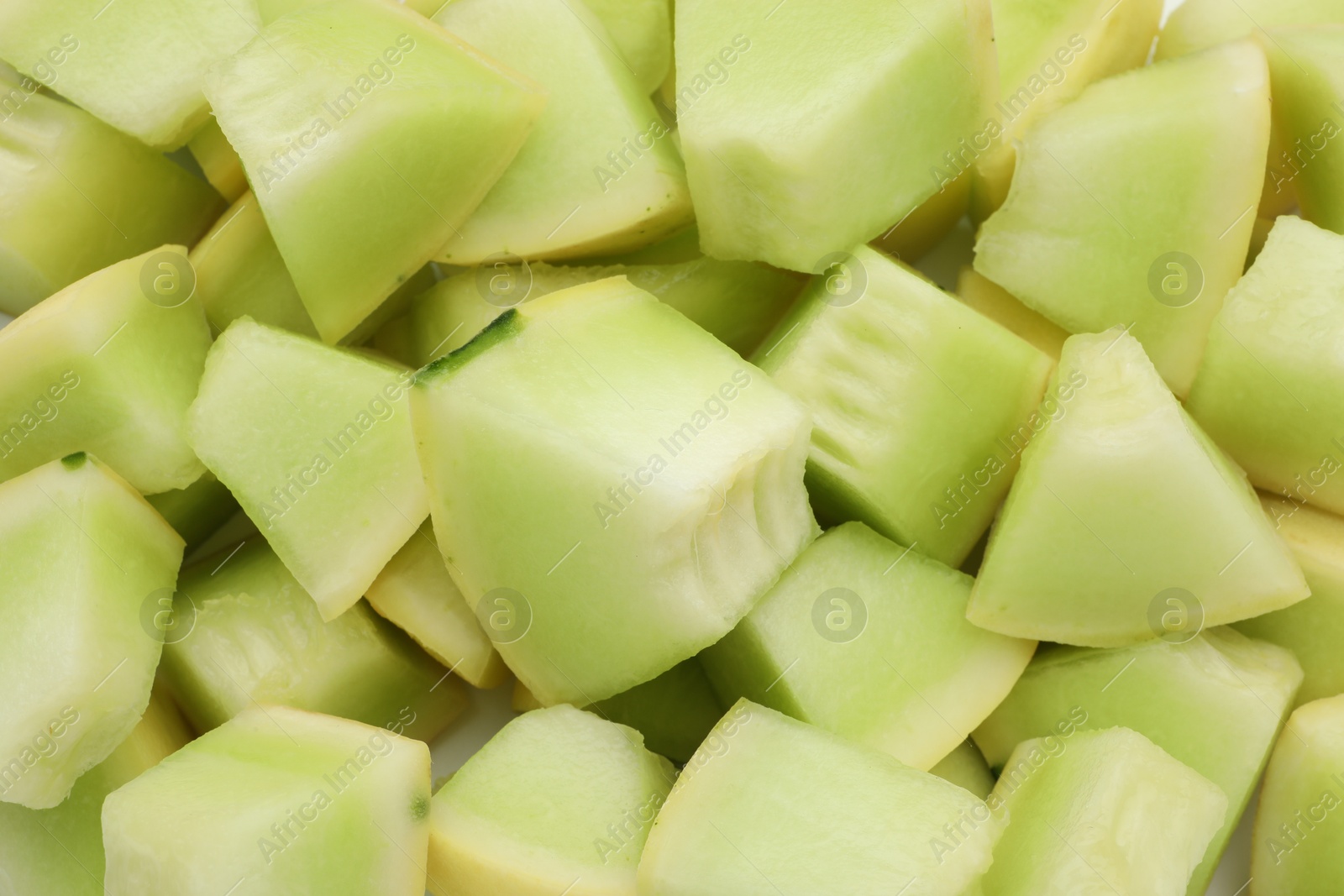 Photo of Many pieces of sweet honeydew melon, closeup