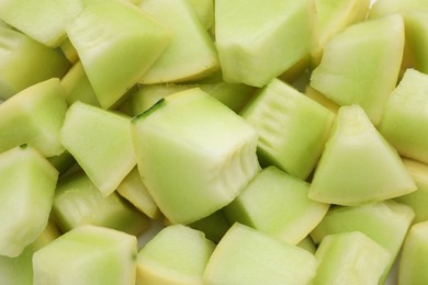 Photo of Many pieces of sweet honeydew melon, closeup