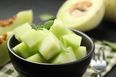 Photo of Slices of yummy melon on table, closeup