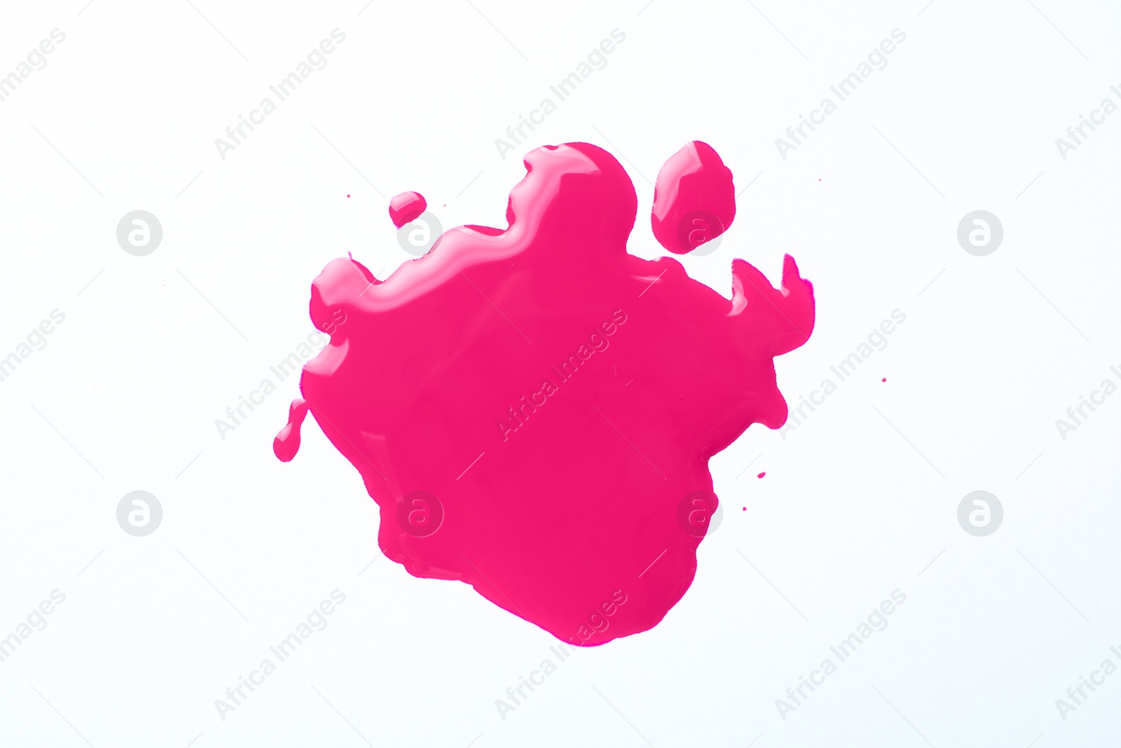 Image of Spot of magenta ink isolated on white, top view