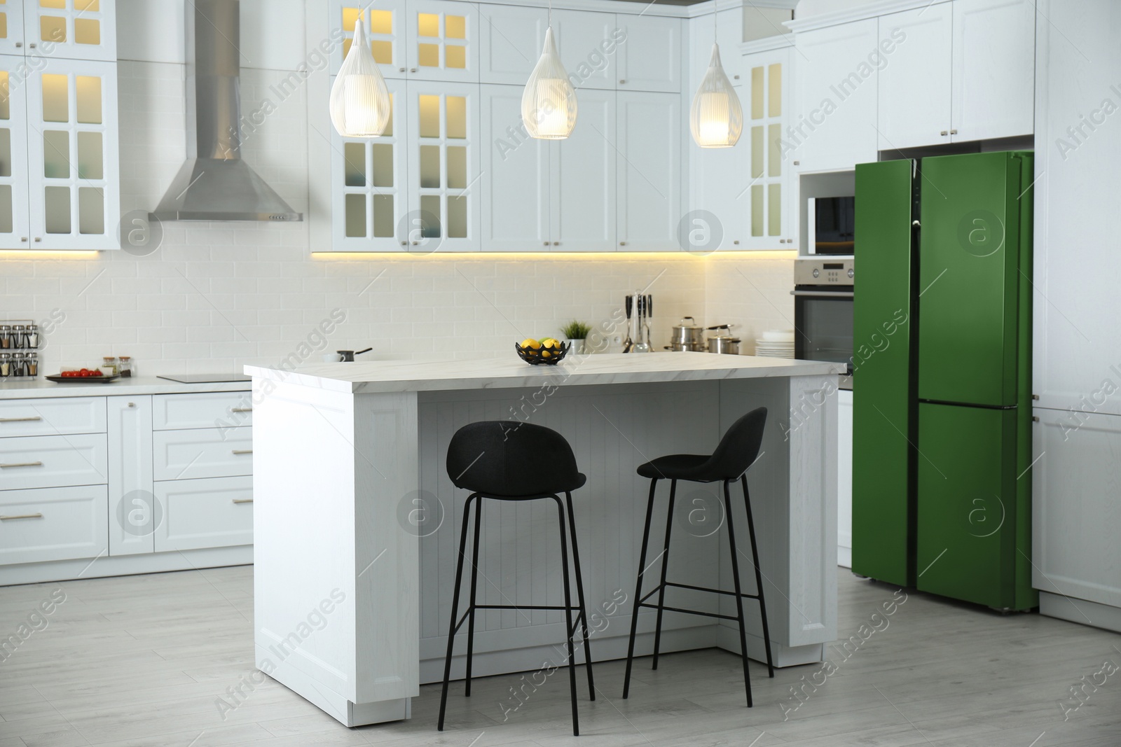 Image of Green refrigerator in kitchen. Bright color accent in interior