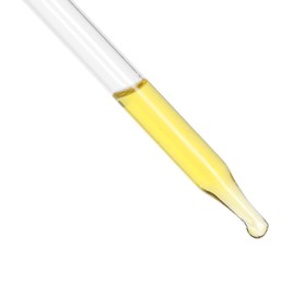 Dripping essential oil from pipette on white background