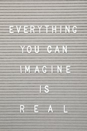 Photo of Letter board with phrase Everything you can imagine is real as background, top view