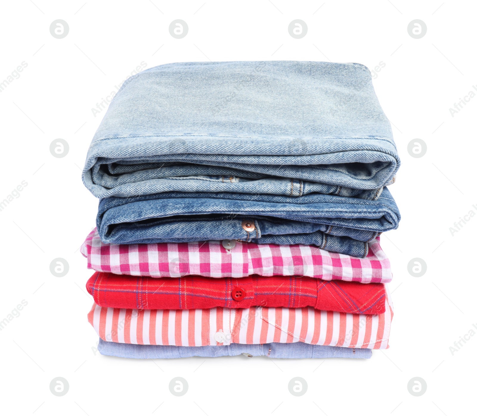 Photo of Stack of shirts and jeans isolated on white