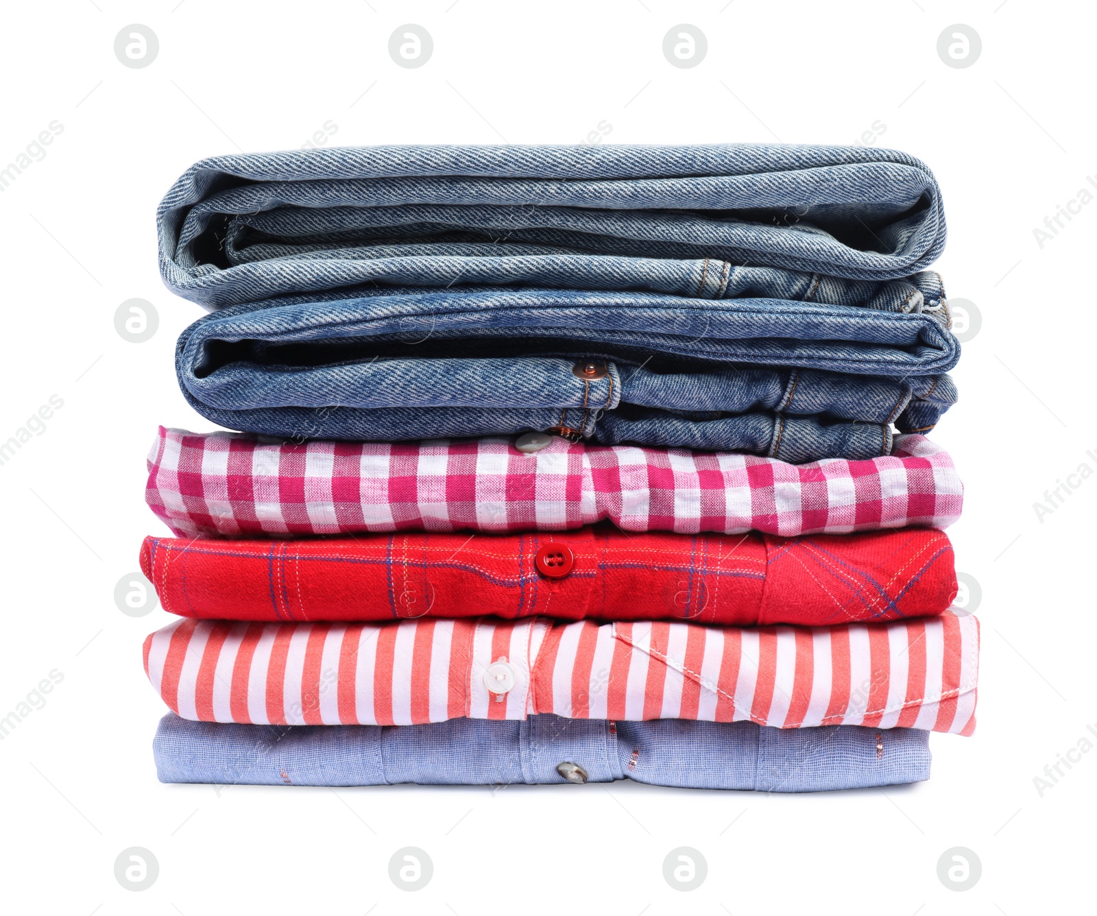 Photo of Stack of shirts and jeans isolated on white