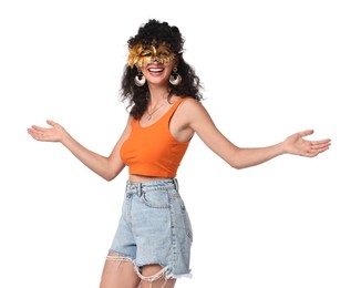 Smiling young woman in carnival mask isolated on white