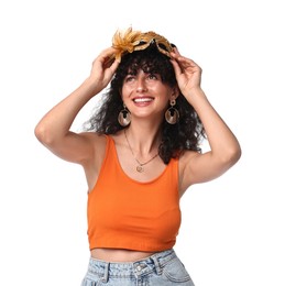 Smiling young woman with carnival mask isolated on white