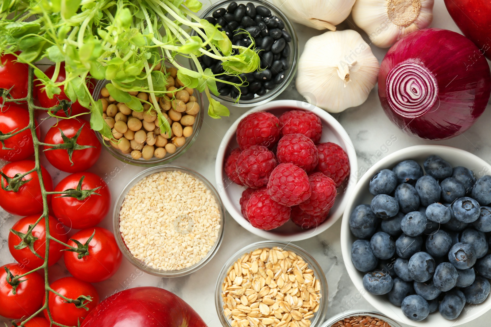 Photo of Different fresh products on white table, flat lay. Source of prebiotics