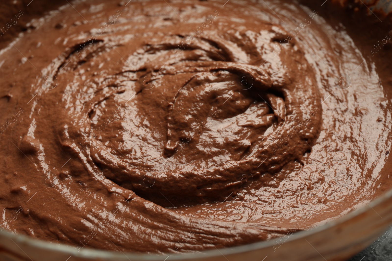 Photo of Fresh chocolate dough in bowl, closeup view