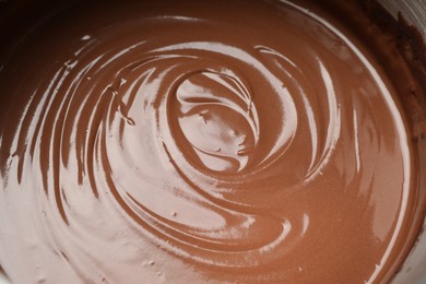 Photo of Chocolate dough in bowl as background, closeup