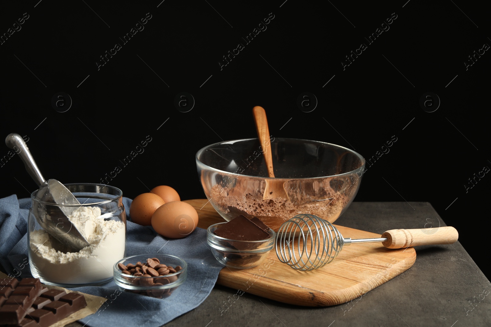 Photo of Ingredients for chocolate dough on grey table